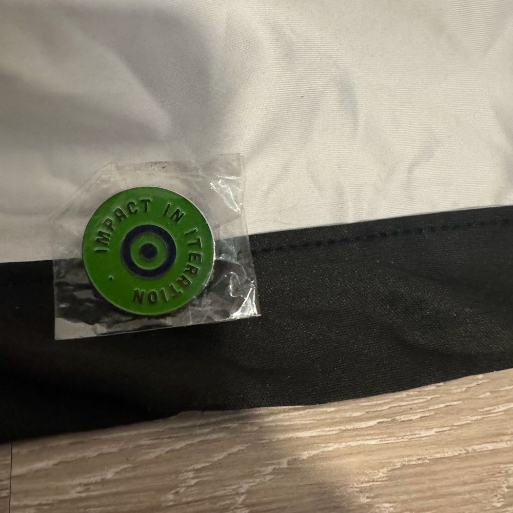 Green and Black Impact in Iteration Hat Pin